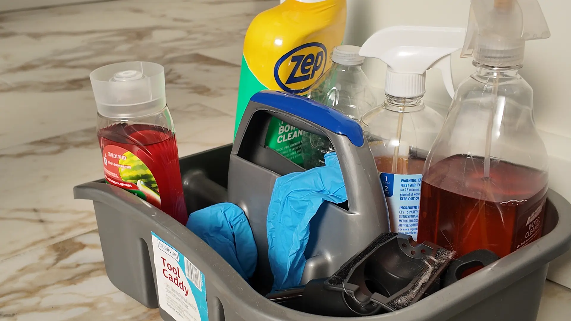 Close-up of organized cleaning supply caddy